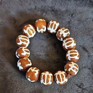 Brown Beaded Stretchy Bracelet with White Turtle Design